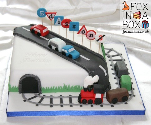 Birthay cake with trains, cars and traffic signs