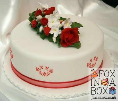Cake with a bouquet of red roses (sugar flowers)
